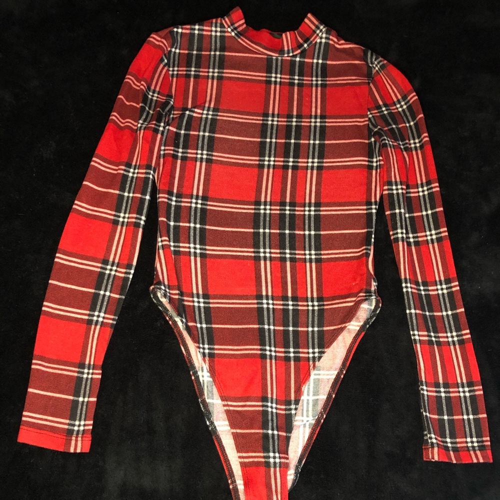 Red plaid turtleneck onesie.